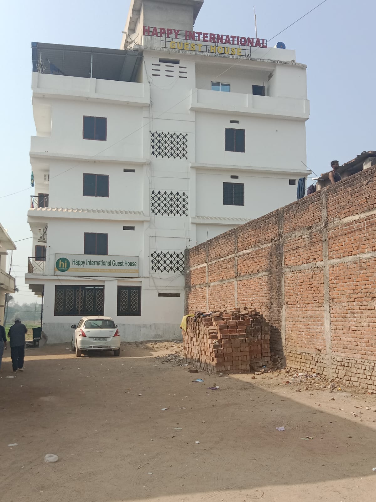 Happy International Guest House exterior building and signage